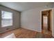 Bedroom with hardwood floors and access to hallway at 857 Garner Rd, Rockmart, GA 30153