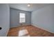 Light-filled bedroom with hardwood floors at 857 Garner Rd, Rockmart, GA 30153