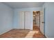 Bedroom with hardwood floors and double doors to closet at 857 Garner Rd, Rockmart, GA 30153