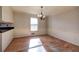 Bright dining room with hardwood floors, chandelier, and wainscoting at 857 Garner Rd, Rockmart, GA 30153