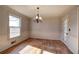 Bright dining room with hardwood floors and chandelier at 857 Garner Rd, Rockmart, GA 30153