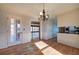 Formal dining room with hardwood floors, chandelier and kitchen access at 857 Garner Rd, Rockmart, GA 30153