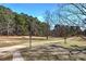 Long driveway leading to a home surrounded by trees at 857 Garner Rd, Rockmart, GA 30153