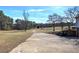 Long driveway leading to house with open fields at 857 Garner Rd, Rockmart, GA 30153