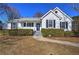 White one-story house with gray roof, landscaping, and walkway at 857 Garner Rd, Rockmart, GA 30153