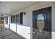 Dark-stained front door with a glass oval insert at 857 Garner Rd, Rockmart, GA 30153
