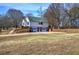 Two-car garage attached to a white house at 857 Garner Rd, Rockmart, GA 30153