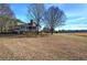 White house with screened porch and large yard at 857 Garner Rd, Rockmart, GA 30153