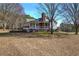 White house with screened porch and large yard at 857 Garner Rd, Rockmart, GA 30153