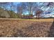 White house with screened porch and large yard at 857 Garner Rd, Rockmart, GA 30153