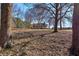 White house with screened porch and large yard at 857 Garner Rd, Rockmart, GA 30153