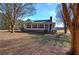 White house with screened porch, deck, and expansive yard at 857 Garner Rd, Rockmart, GA 30153