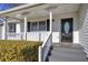 White house exterior with a porch and landscaping at 857 Garner Rd, Rockmart, GA 30153