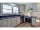 Updated kitchen with stainless steel appliances and granite countertops at 857 Garner Rd, Rockmart, GA 30153