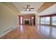 Bright living room featuring hardwood floors, a fireplace, and a ceiling fan at 857 Garner Rd, Rockmart, GA 30153