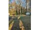Large backyard with mature trees and storage shed at 6050 Ledgewood Dr, Forest Park, GA 30297