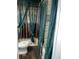 Bathroom with toilet, bathtub, and dark green lace curtains at 6050 Ledgewood Dr, Forest Park, GA 30297