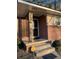 Brick front porch with steps leading to the front door at 6050 Ledgewood Dr, Forest Park, GA 30297