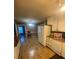 Kitchen with white cabinets and hardwood floors at 6050 Ledgewood Dr, Forest Park, GA 30297