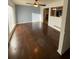 Spacious living room featuring hardwood floors and a ceiling fan at 6050 Ledgewood Dr, Forest Park, GA 30297