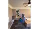 Brick-walled sunroom with access to kitchen and storage boxes at 6050 Ledgewood Dr, Forest Park, GA 30297