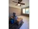 Sunroom with brick walls, wood flooring, and ceiling fan at 6050 Ledgewood Dr, Forest Park, GA 30297
