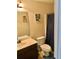 Clean bathroom with single sink vanity, toilet, and shower/tub combo at 116 Birchwood Ct, Loganville, GA 30052