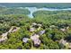 Aerial view of homes nestled in lush greenery near lake at 15 Amberly Ln, Cartersville, GA 30121
