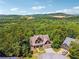 Aerial view of home with wooded backdrop at 15 Amberly Ln, Cartersville, GA 30121