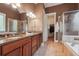 Spa-like bathroom with double vanity, granite counters, and walk-in shower at 15 Amberly Ln, Cartersville, GA 30121