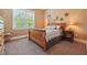 Charming bedroom with a wooden sleigh bed and neutral decor at 15 Amberly Ln, Cartersville, GA 30121