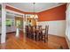 Spacious dining room with hardwood floors, a chandelier, and view into the kitchen at 15 Amberly Ln, Cartersville, GA 30121