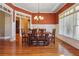 Formal dining room with hardwood floors, an ornate chandelier, and rich colored walls at 15 Amberly Ln, Cartersville, GA 30121