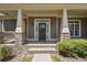 Brick columns and steps lead to a charming double front door entry at 15 Amberly Ln, Cartersville, GA 30121