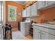 Bright laundry room with washer, dryer, and ample storage at 15 Amberly Ln, Cartersville, GA 30121