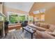 Spacious living room with hardwood floors, stone fireplace, and views to the backyard at 15 Amberly Ln, Cartersville, GA 30121