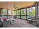 Relaxing screened porch with wooded views and comfortable seating at 15 Amberly Ln, Cartersville, GA 30121