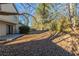 Large backyard with mature trees and patio at 2522 Corner Shoals Dr, Decatur, GA 30034