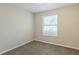 Well-lit bedroom with neutral walls and carpet at 2522 Corner Shoals Dr, Decatur, GA 30034