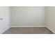 Simple bedroom with neutral walls and carpet at 2522 Corner Shoals Dr, Decatur, GA 30034