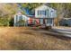 Two-story house with a red door and brown deck at 2522 Corner Shoals Dr, Decatur, GA 30034