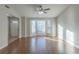 Spacious living room with hardwood floors, large windows and ceiling fan at 2522 Corner Shoals Dr, Decatur, GA 30034