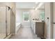 Main bathroom with soaking tub, shower, and double vanity at 3811 River Rock Rd, Lithonia, GA 30038