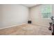 Spacious bedroom with neutral decor and large window at 3811 River Rock Rd, Lithonia, GA 30038