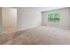 Well-lit bedroom with neutral carpeting and closet space at 3811 River Rock Rd, Lithonia, GA 30038