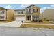 Two-story home with a brick facade and a driveway at 3811 River Rock Rd, Lithonia, GA 30038