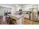 Modern kitchen with island, granite countertops and stainless steel appliances at 3811 River Rock Rd, Lithonia, GA 30038