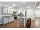 Modern kitchen with island, granite countertops and stainless steel appliances at 3811 River Rock Rd, Lithonia, GA 30038
