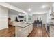 Open kitchen with granite countertops and stainless steel appliances at 3811 River Rock Rd, Lithonia, GA 30038