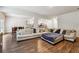 Open living room showcasing a spacious sectional sofa and hardwood floors at 3811 River Rock Rd, Lithonia, GA 30038